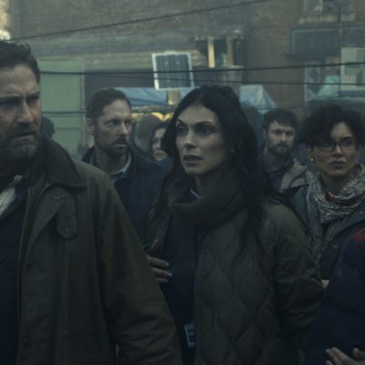 Gerard Butler as John Garrity, Morena Baccarin as Allison Garrity, Amber Rose Revah as Dr. Casey Amina, and Roman Griffin Davis as Nathan Garrity in Greenland 2: Migration. Photo Credit: Courtesy of Lionsgate